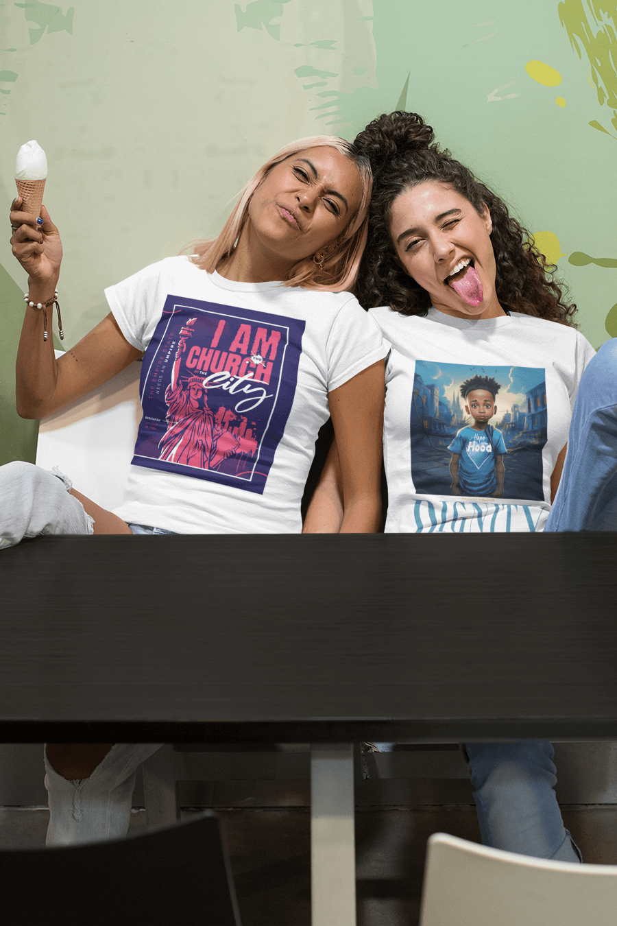 Two Girls wearing tee shirts from two of our collections